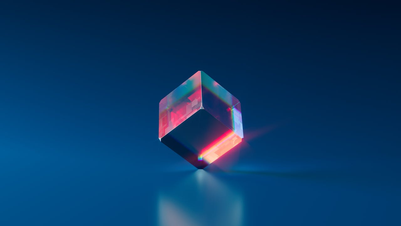 A vibrant and futuristic 3D cube with glowing edges on a dark blue background.